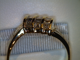 After Channel Repairs, Notice the difference in height of the gold above the diamonds from the original picture. This allows your diamonds to stay tight and protected