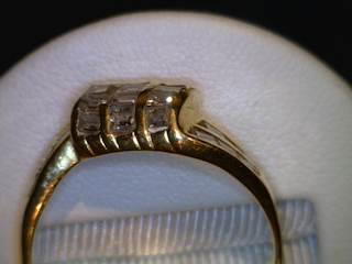 Before Channel repair, Note there is no metal above the diamonds leaving them at risk to fall out or be damaged