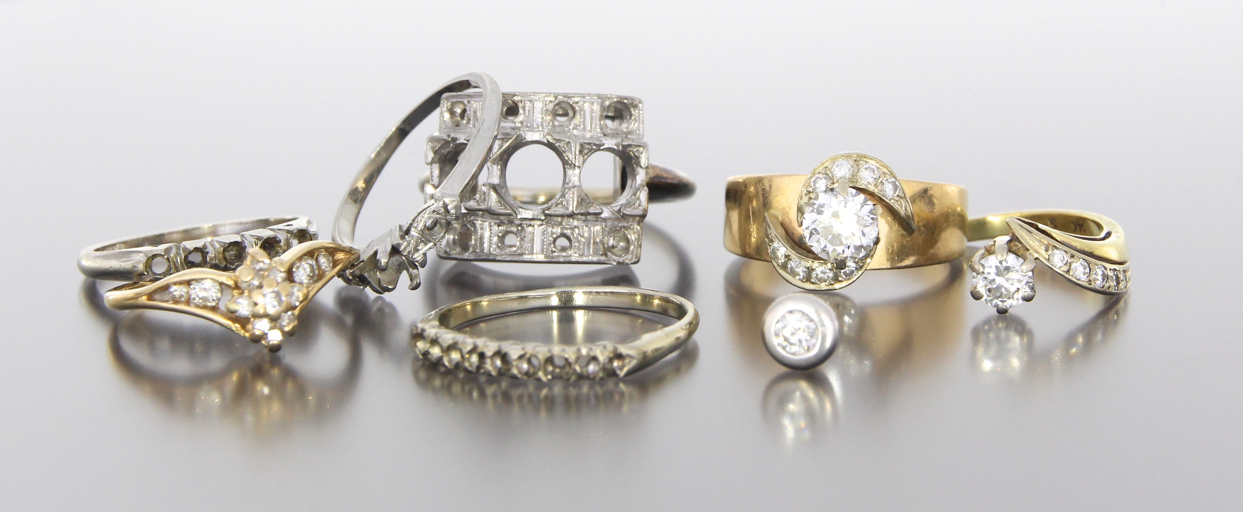 A collection on sentimental pieces, old rings that were out of style, and left over gold with a wish to create something new and beautiful from her pieces....