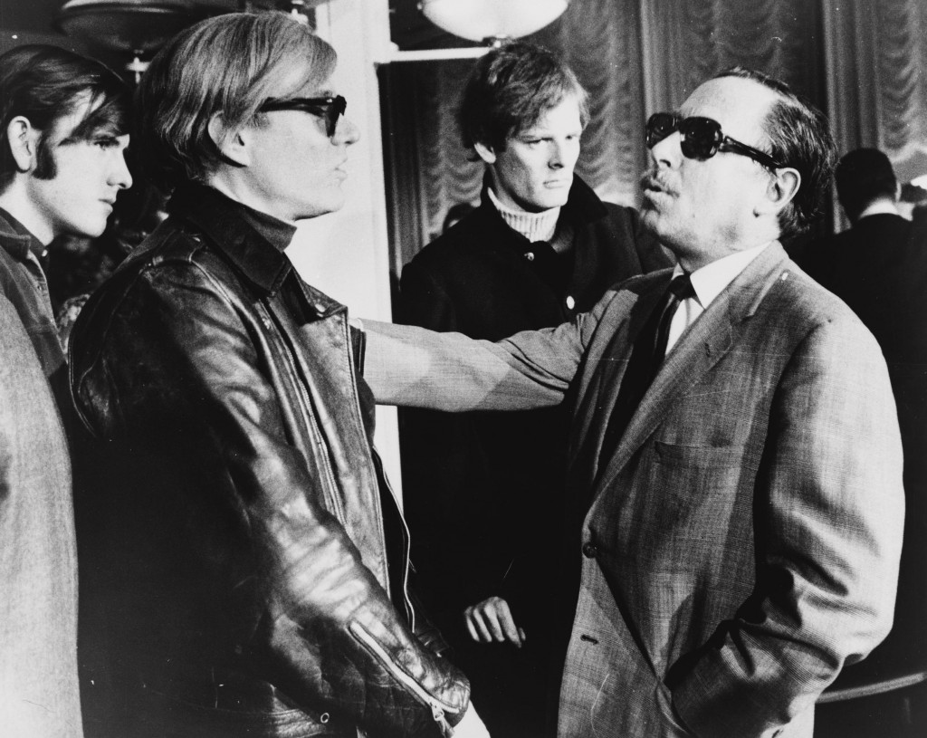 Man wearing a sweater 'Photo Bombs' Andy Warhol and Tennessee Williams