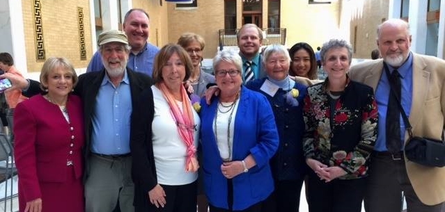 Ruth Dain (center between State Representative Kay Khan and her husband Bill) at the State House in July, 2015 receiving the Unsung Heroine Award from the Massachusetts Commussion on the Status of Women. 