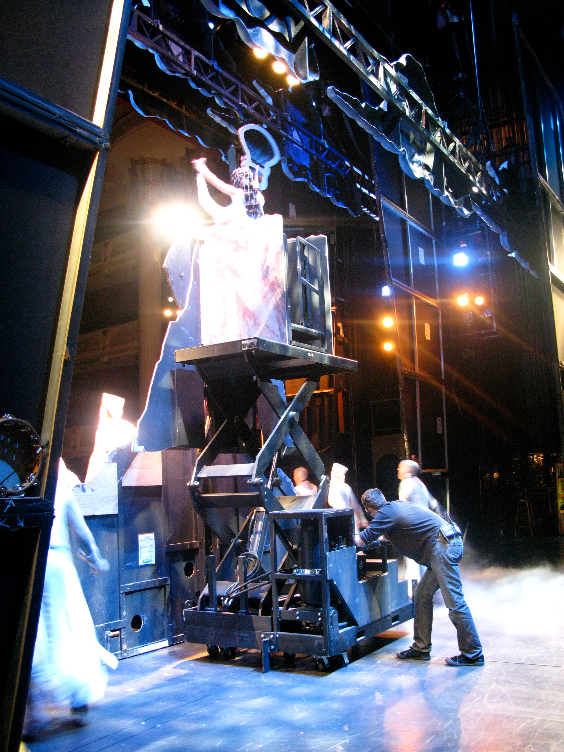 Stagehands behind the "grail" on Spamalot