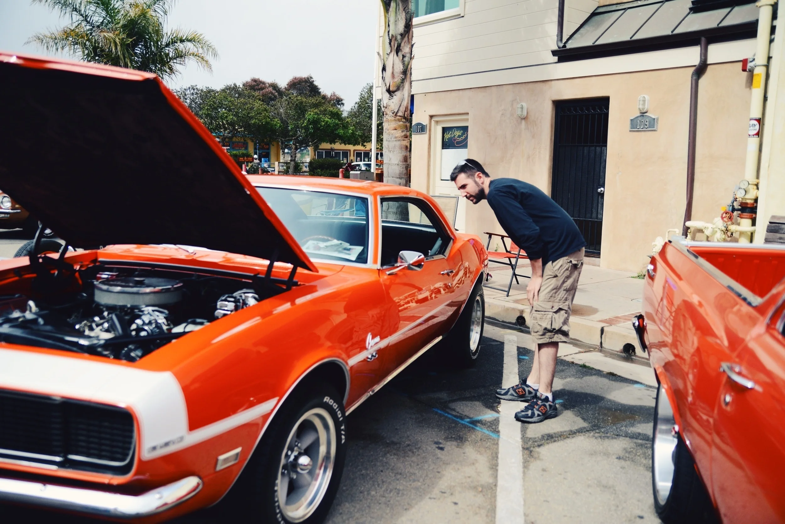 Eric checking out a Camaro similar to his own.