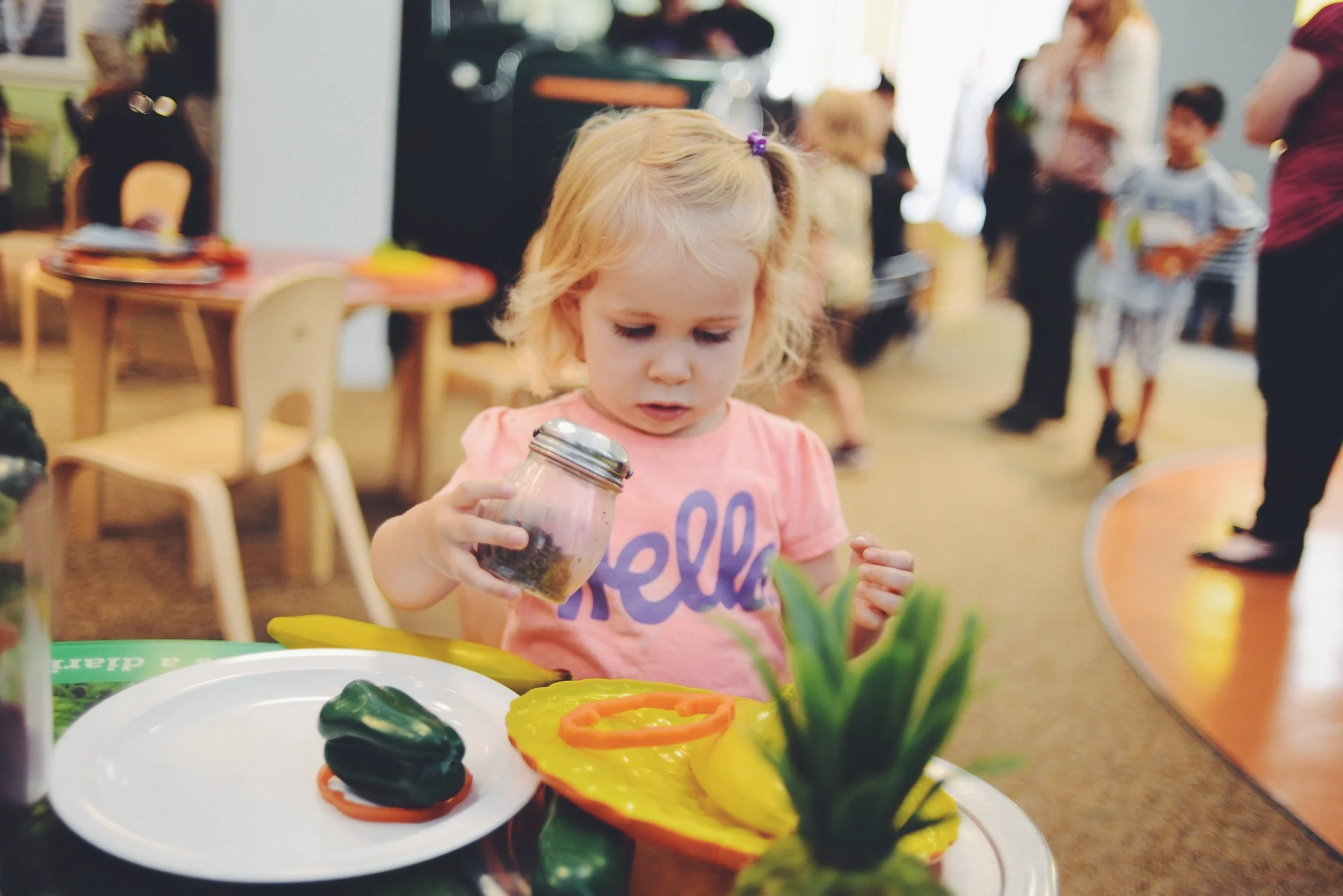 Lucy "making pizza" at the Children's Discovery Museum.