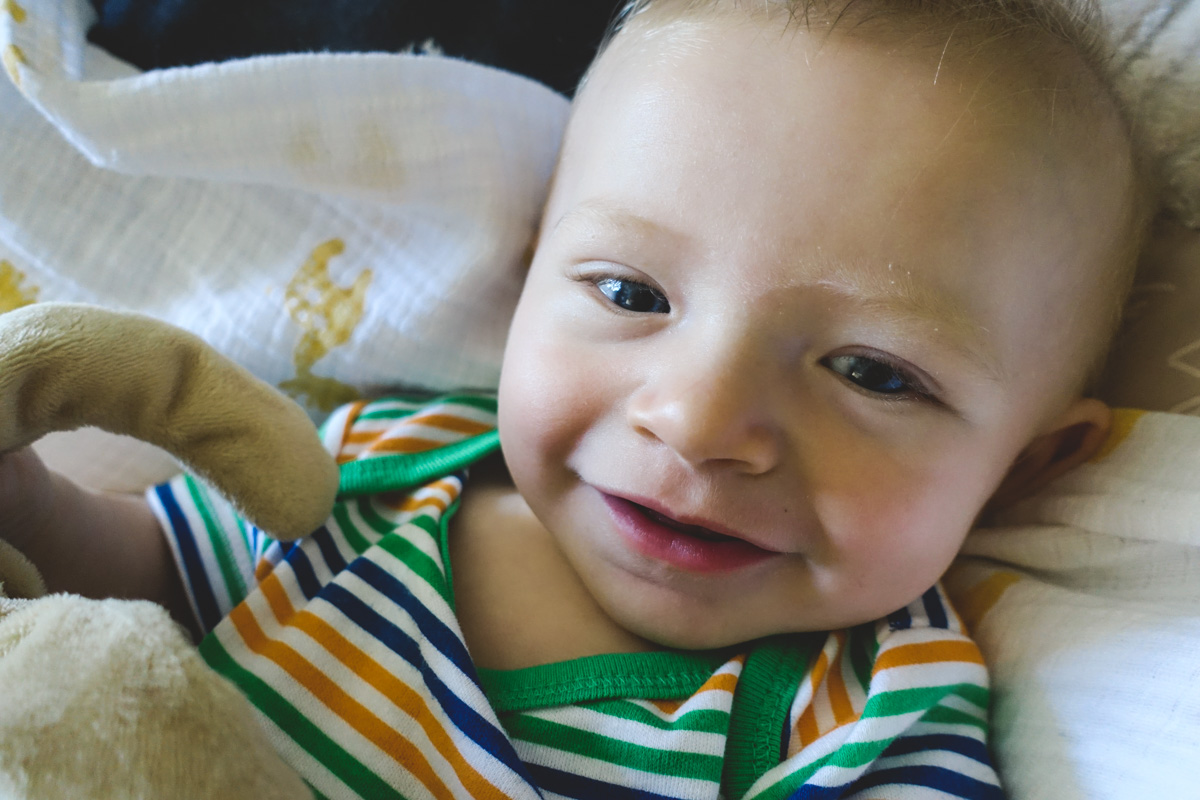 2:30pm: Smiley boy chillin' in his bouncer.