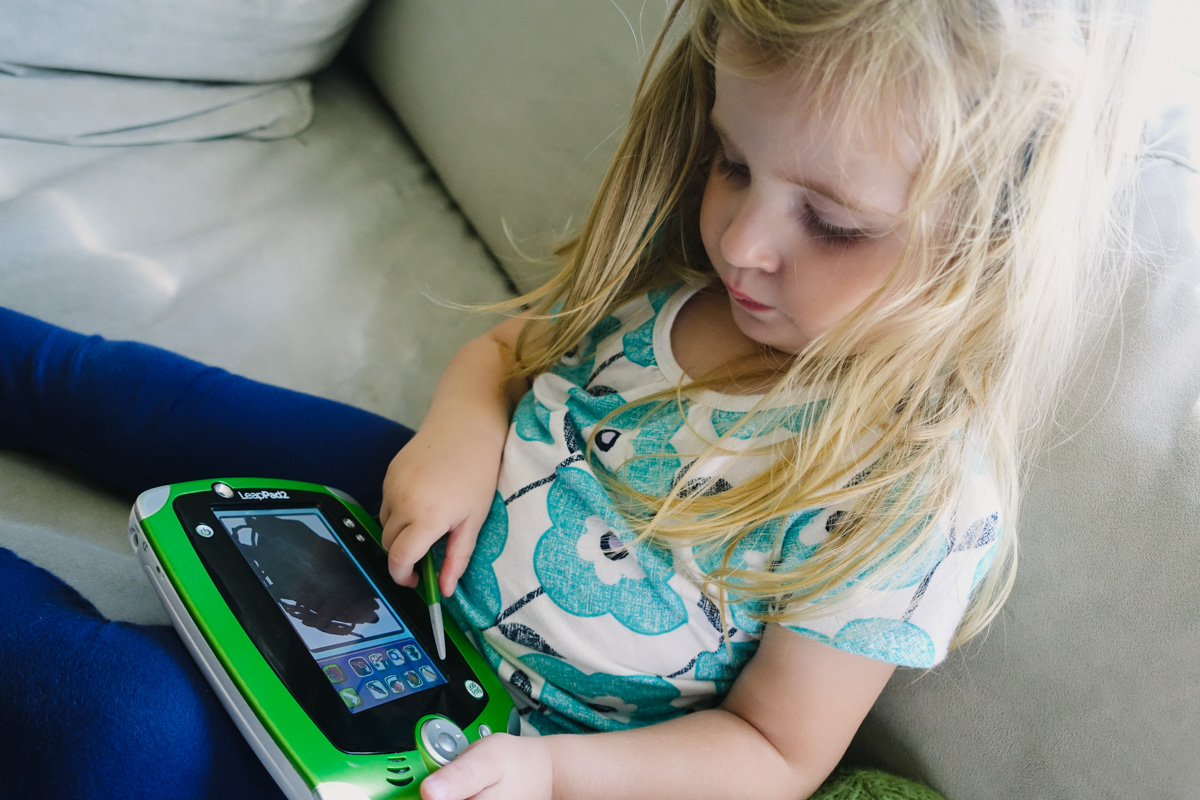 2:55pm: A little bit of LeapPad before nap. She's been told she has until the clock says 3-0-0.