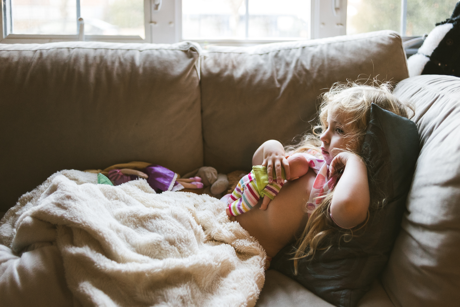 Nursing her baby.