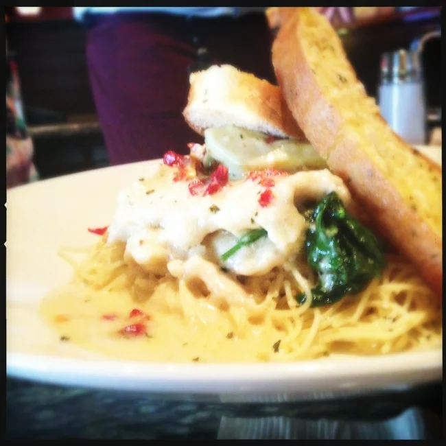 Andrea decided on the Tuscan Chicken Limone, featuring Sautéed with garlic, artichoke hearts, sun-dried tomatoes in a lemon butter sauce. Served over delicate angel hair pasta with fresh steamed baby spinach. She says it was delicious.