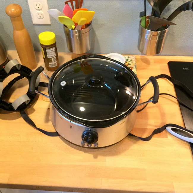 Positioning the crock-pot over the straps couldn't be any easier. As you can see, my crock pot from Hamilton-Beach is fairly unique, with the heater not even reaching half-way up the side of the crock.