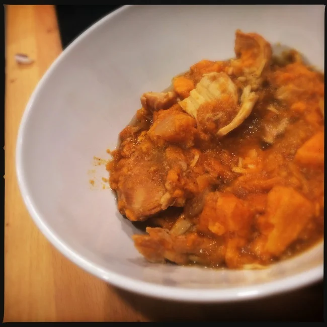 Chicken slow cooked with Yams, Apple Sauce, and curry make a hearty fall dinner that will warm anyone up.