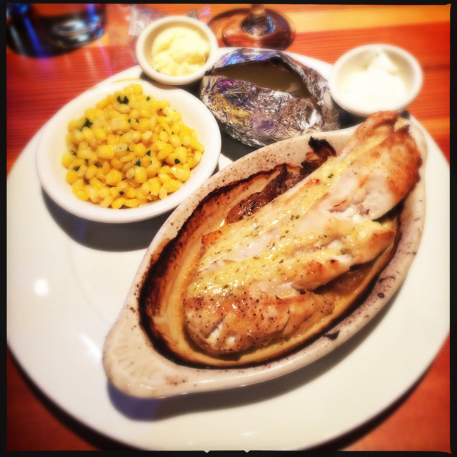 The Rockfish Steverino is served with grilled sweet corn and your choice of baked potato or fries