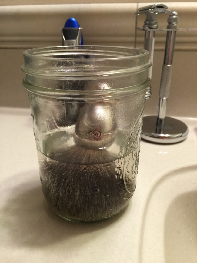 Step Two: Prep your shaving brush by soaking it in warm water to soften the bristles