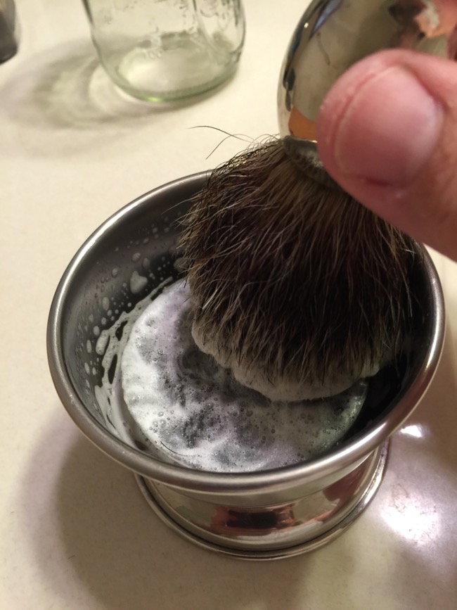 Step Four: Build a lather with your brush. Start with as little water as you can and add water as needed to get lather to desired consistency.