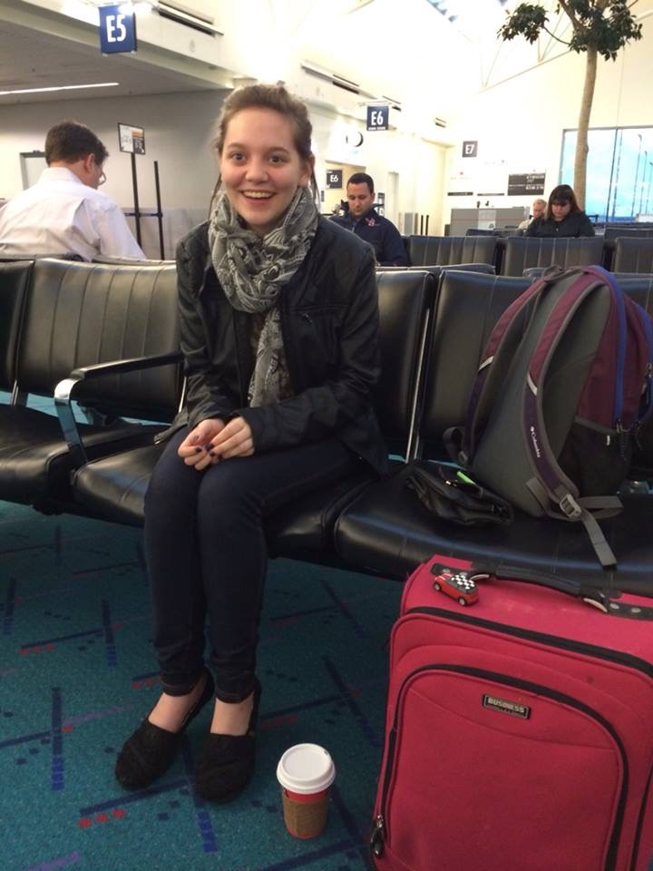 Andrea excitedly waiting for the plane
