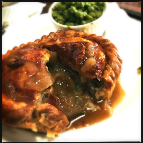 Pork Shank, Kale, Smokey Blue, and Tyme pie with Onion gravy. Mint mashed peas in the background