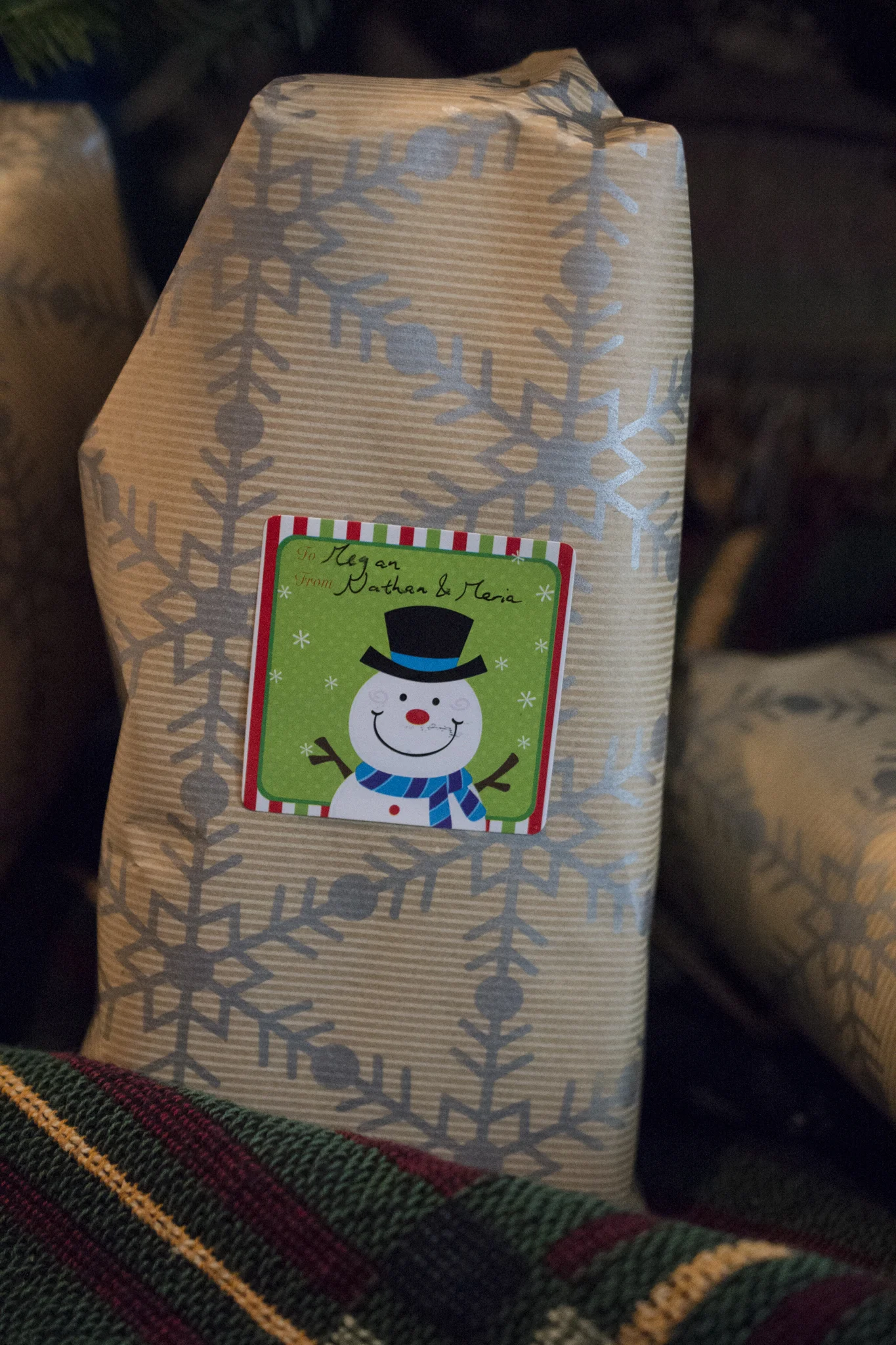 Christmas gifts in snowflake wrapping paper