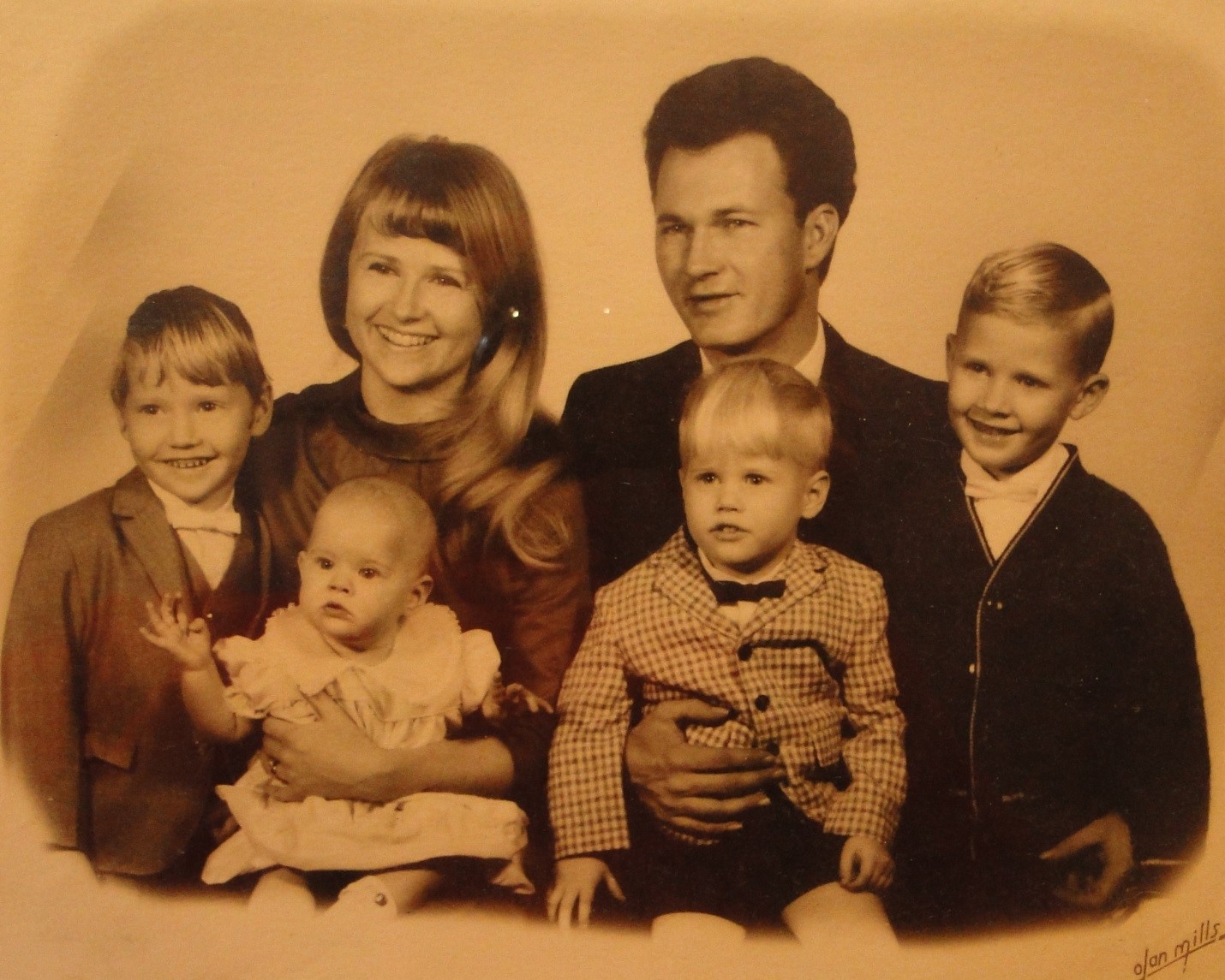 This is a picture of my mom (holding me), my dad, and my three brothers. Priceless!