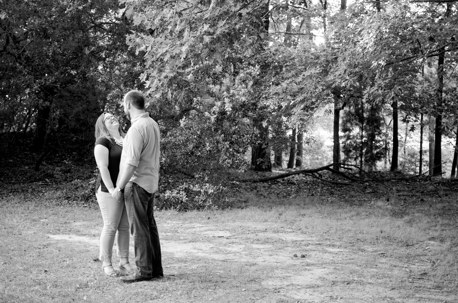 Joyful engagement pictures at Lions Bridge Park in Newport News, Virginia (black and white)