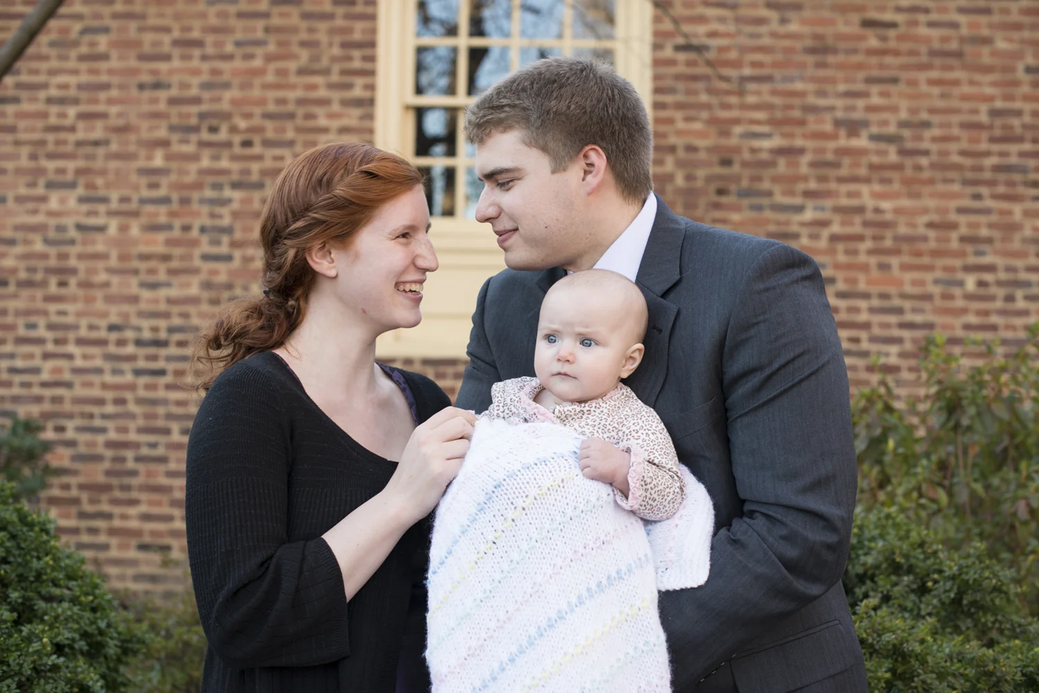 Family photo of parents with baby