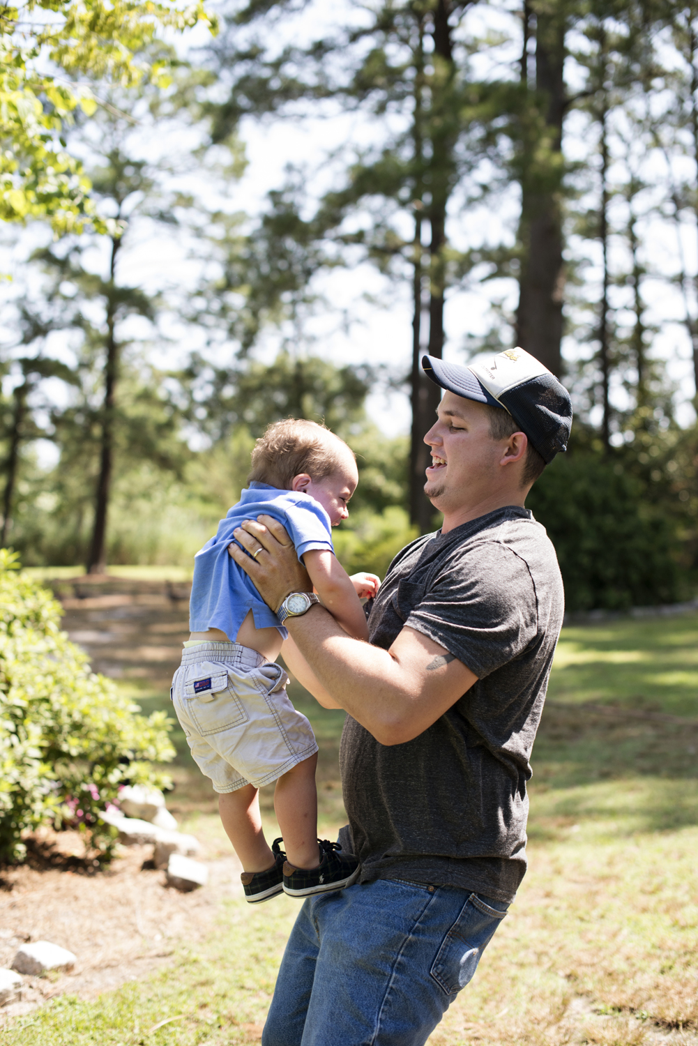 Dad playing with his son at family portraits in Portsmouth, Virginia