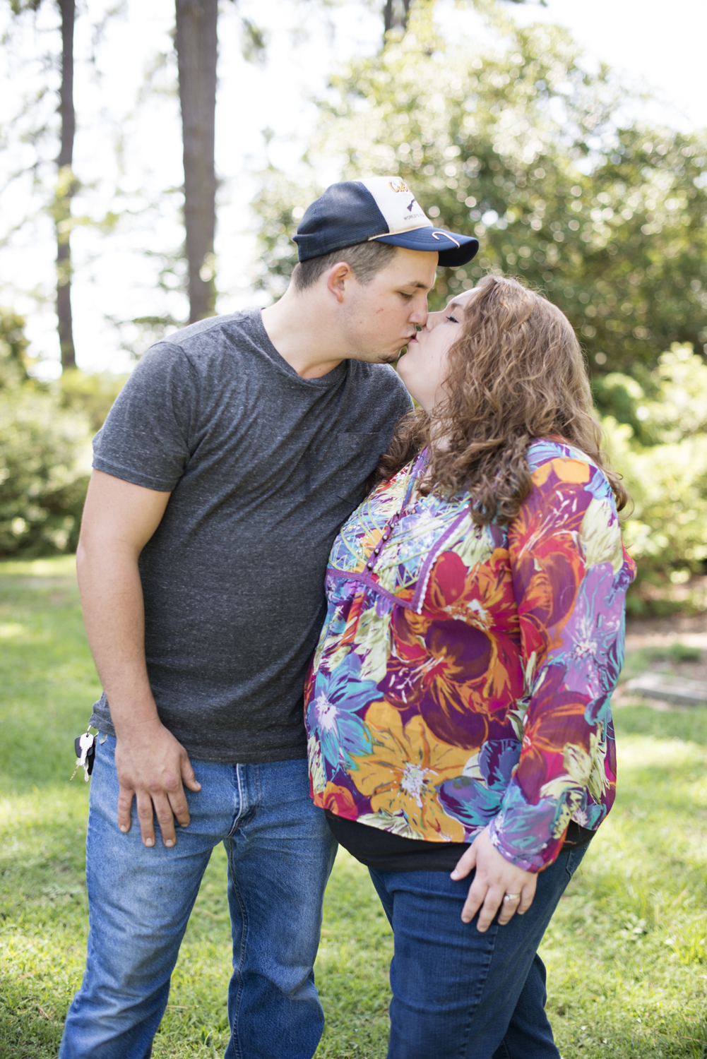 Husband and wife kissing at family portraits in Portsmouth, Virginia