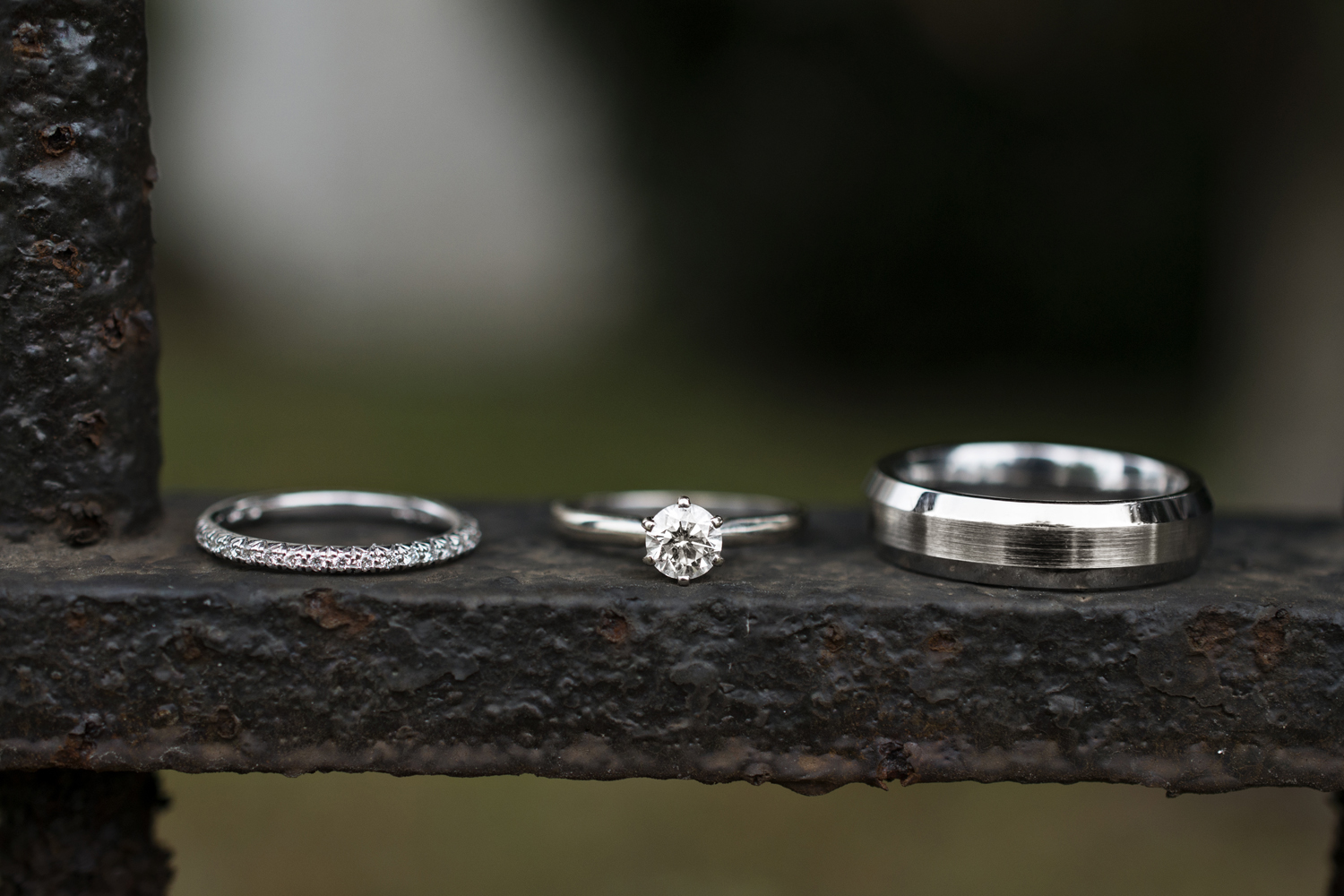 Wedding rings on a fence post