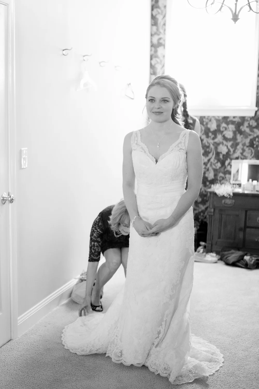 Bride sees herself in the mirror for the first time on her wedding day.