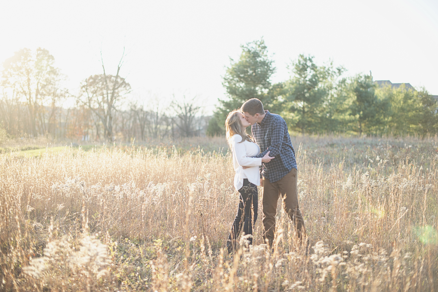 Destination Northern Virginia Engagement Session | Casual J Crew engagement pictures in field with golden light