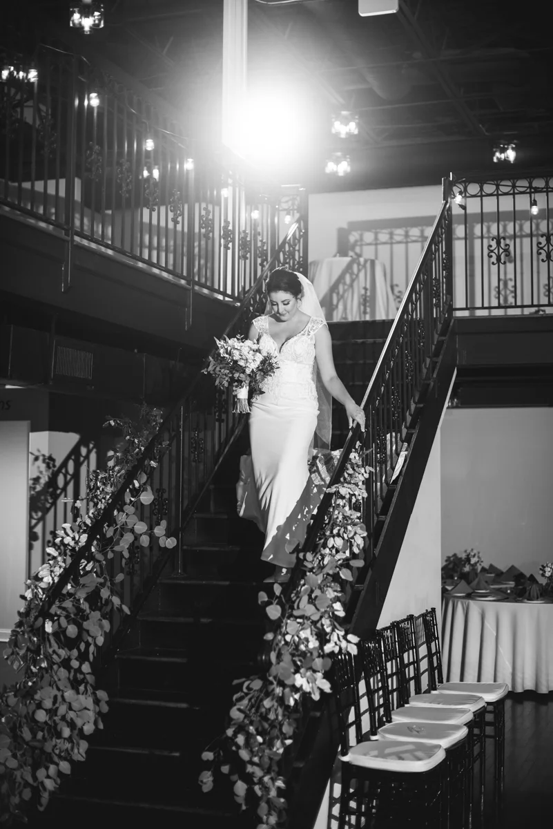 Minimalist White and Green Summer Wedding | Bride walking down the steps