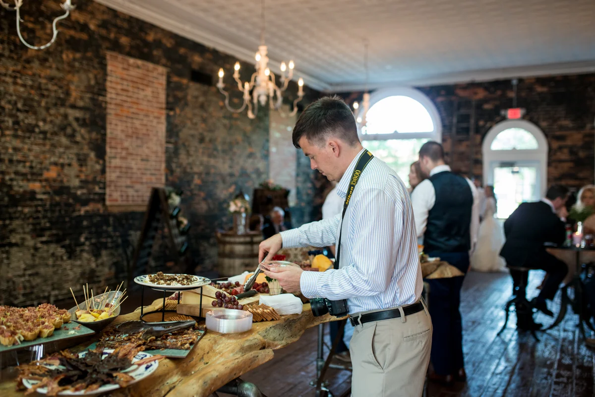 If he isn’t hanging dresses, arranging flowers, fluffing trains, or putting up curtains…he’s probably eating!