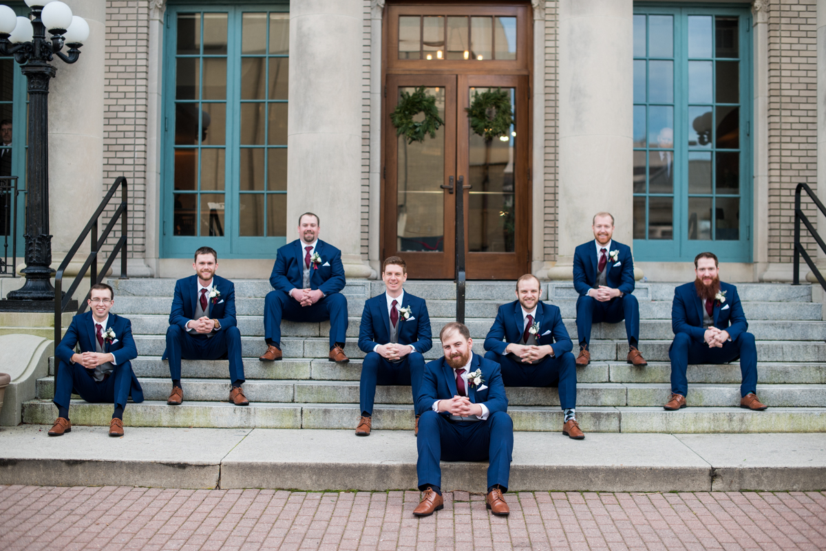 Burgundy and Pale Blue Winter Wedding | Navy blue groomsmen portraits
