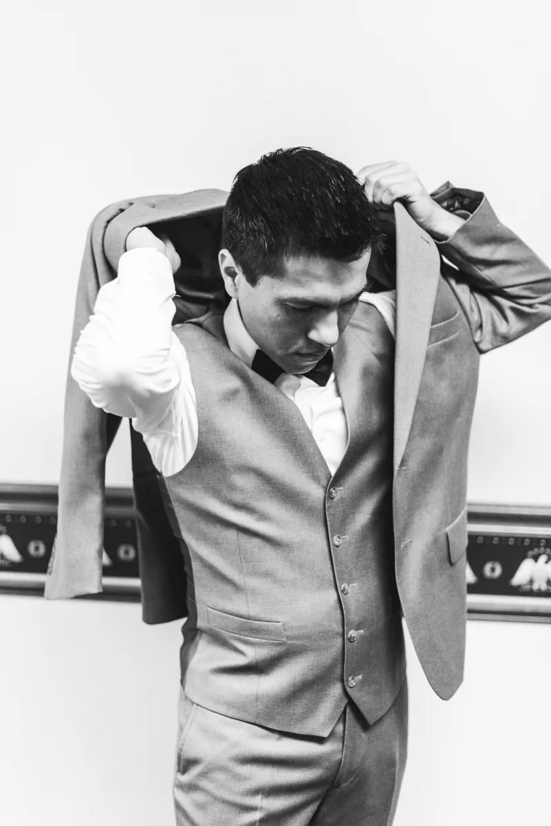 Joy-Filled Wedding with Rose Gold Details | Groom getting ready