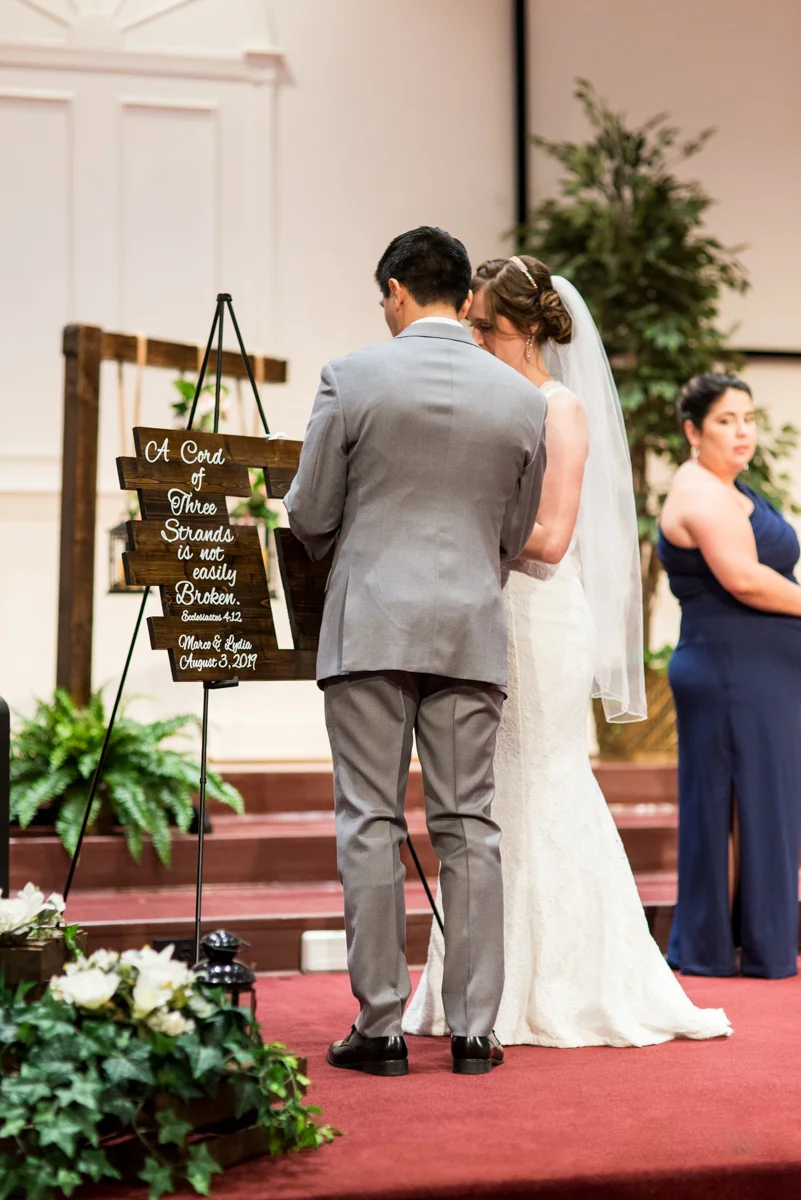 Joy-Filled Wedding with Rose Gold Details | Wedding Braid Tying Tradition