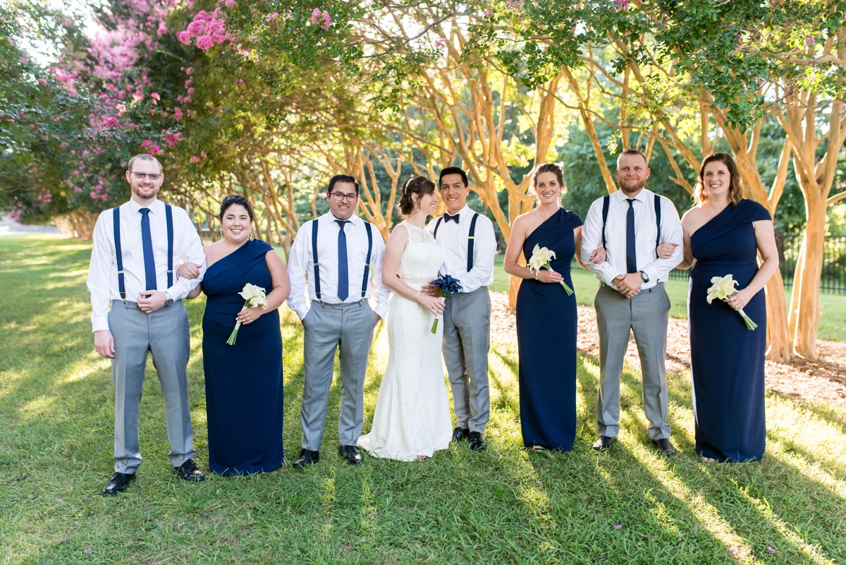 Joy-Filled Wedding with Rose Gold Details | Bridal Party Portraits with Navy Blue Details