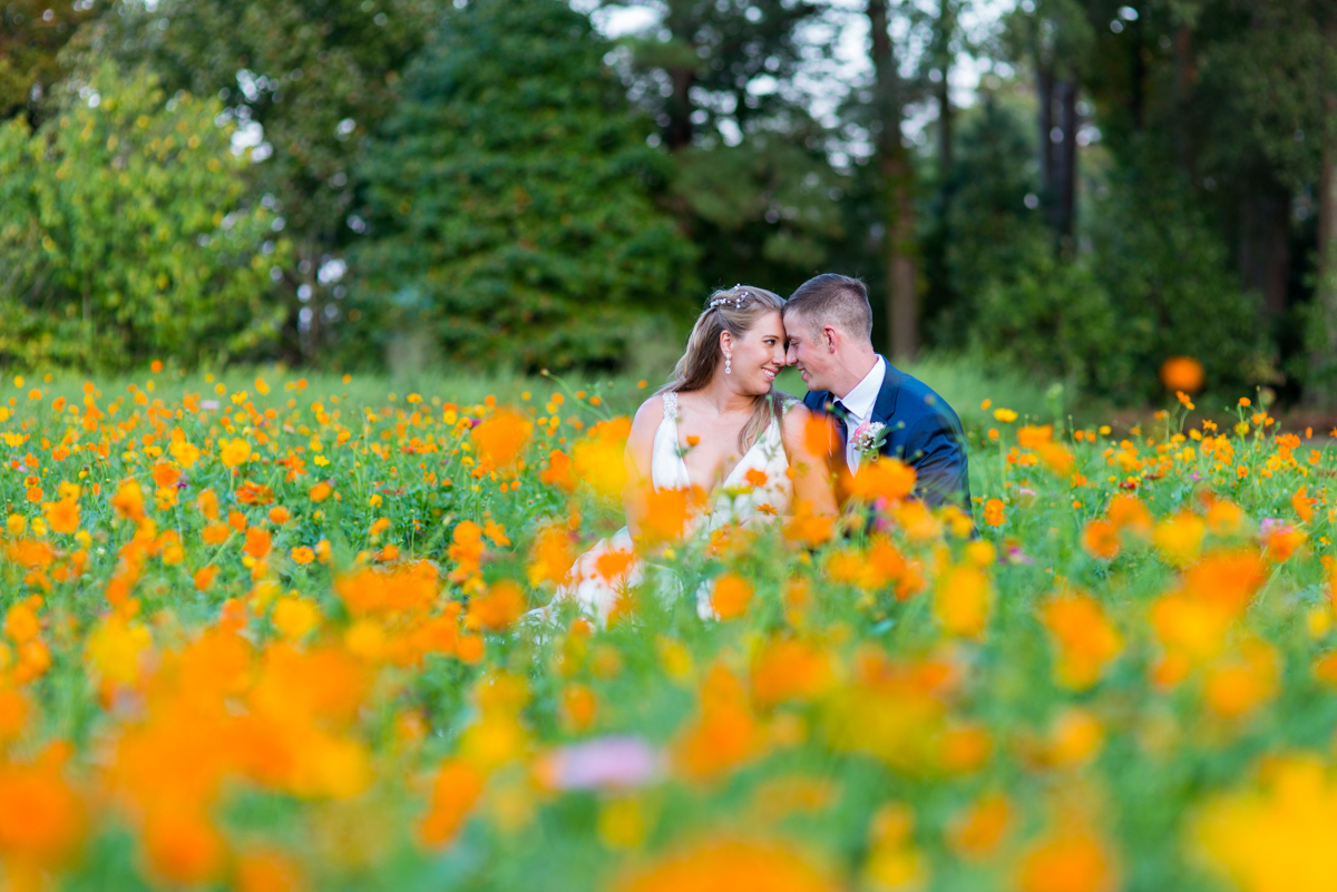 Bright Fall DIY Wedding | Bride and groom pictures in wildflower field
