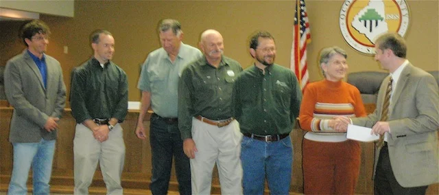 Shea Airey, far right, chairman of the Oconee County Conservation Bank, accepts a $1,200 donation from Oconee Forever's Alice Wald, second from right, at OCCB’s December 6 meeting. Other Conservation Bank members present were: left to right, Andy Lee, Rocky Nation, Lynn Harwell, Ed Land, Marvin Prater.