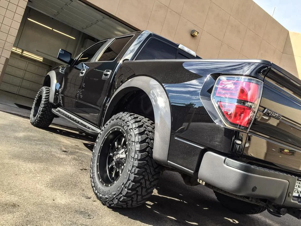 Concours-level paint correction on this Ford Raptor to remove "AZ pinstripes" after an off-road mishap.