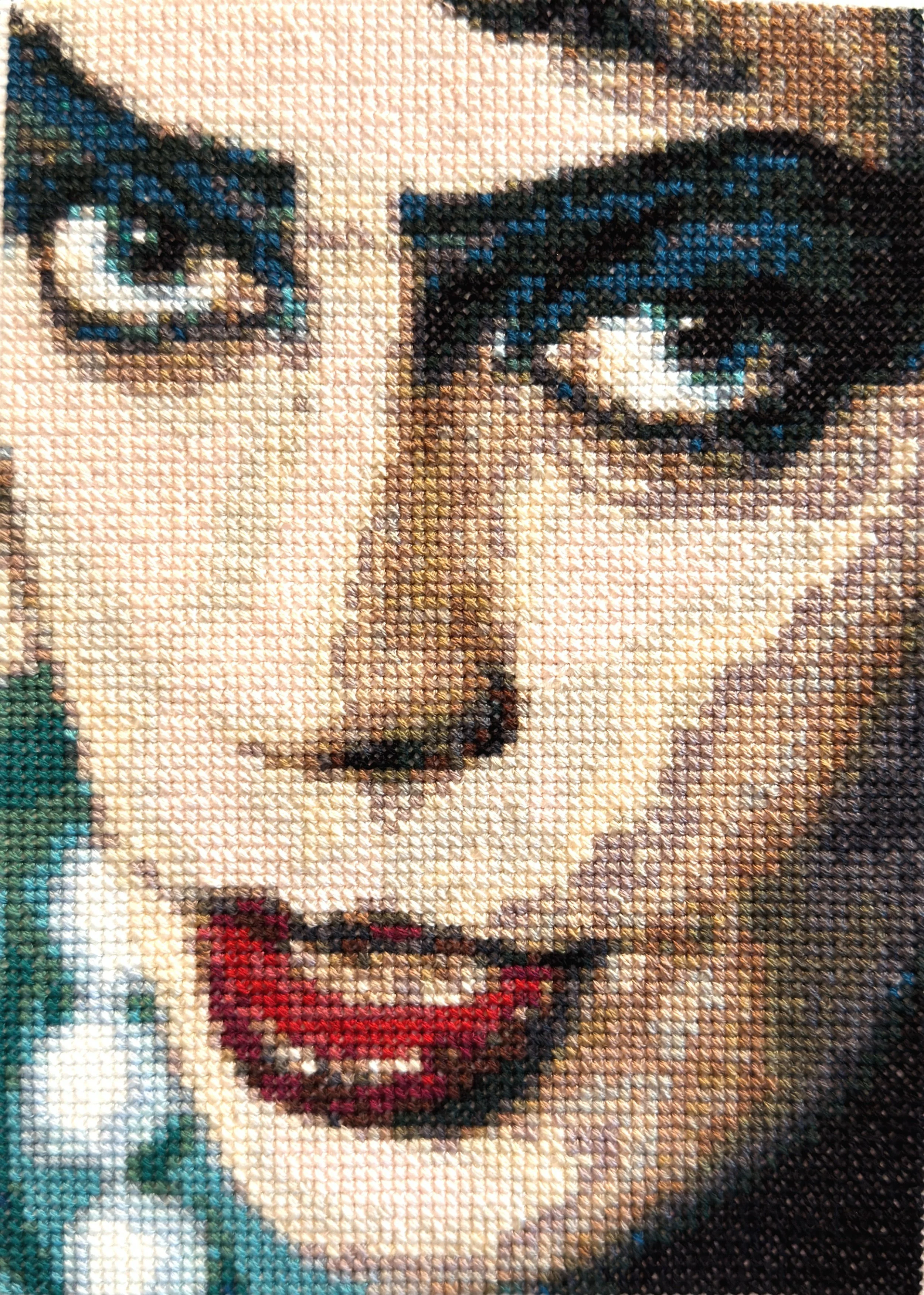 Cross-stitch close-up of Tim Curry's face as Dr Frank-n-Furter in The Rocky Horrow Picture Show
