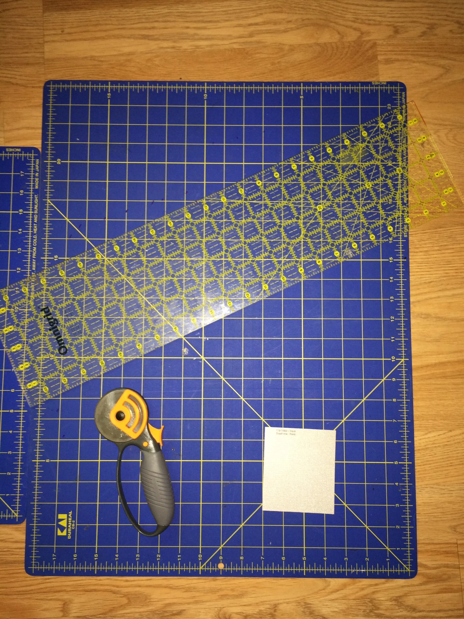 Tools used for the project, a rotary cutter, straight edge and a good cutting surface.