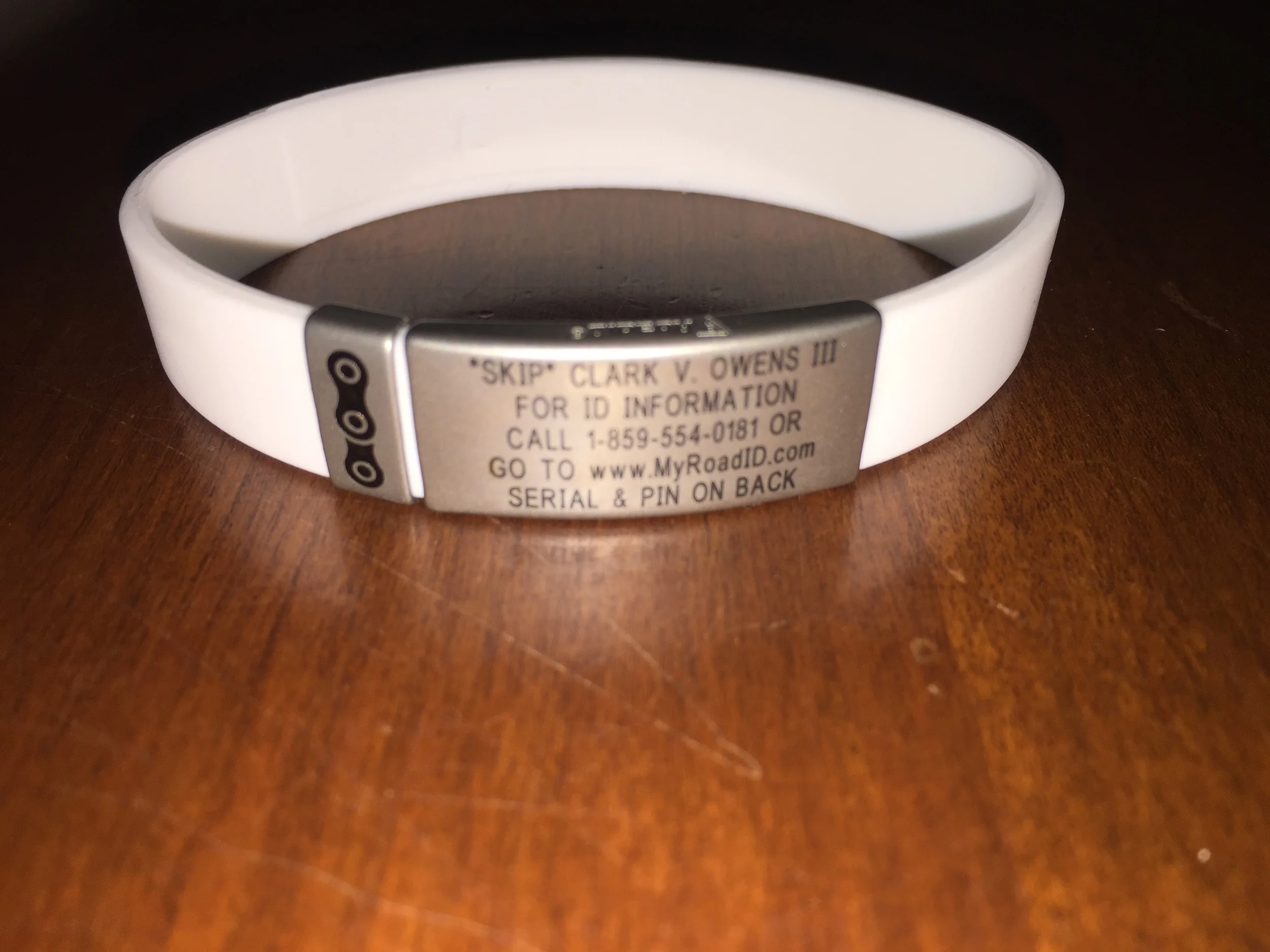My white Wrist ID Slim with my bike chain link badge add-on