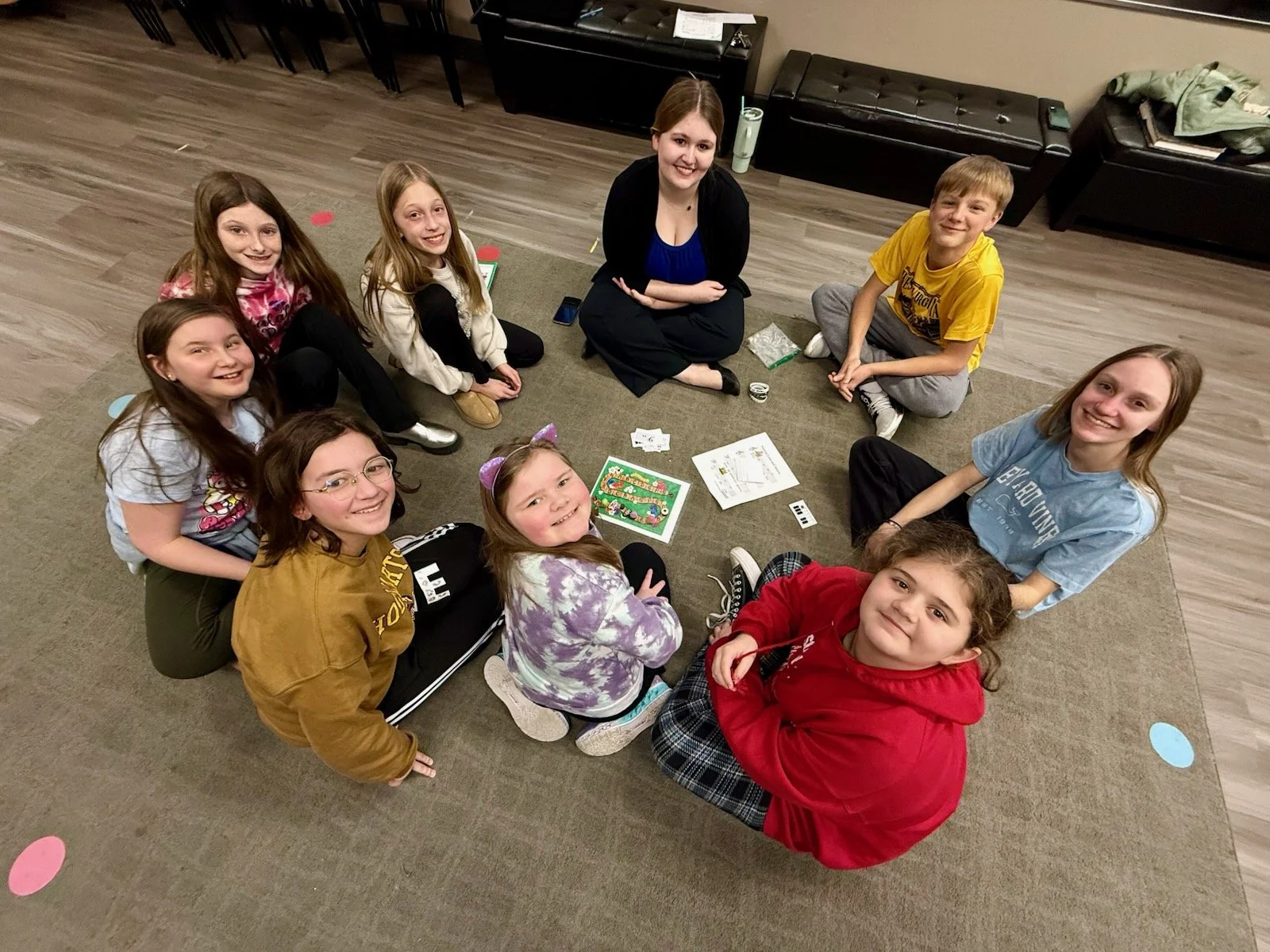 Piano students at the Music Studio of Patricia Keith sit in a circle while learning.
