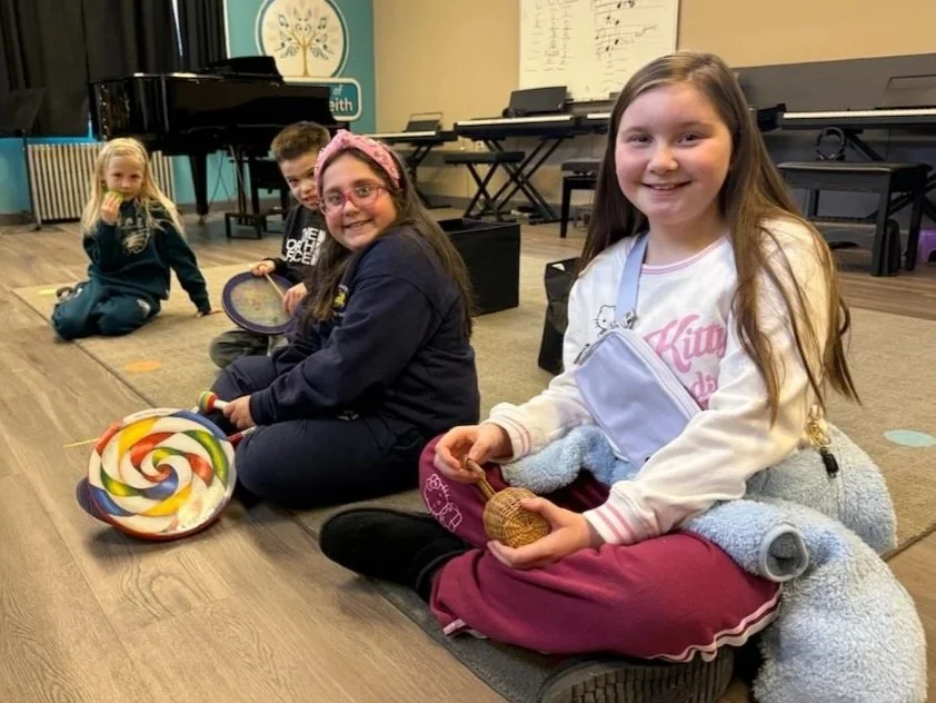 Students play percussion instruments in Elementary Voice Class at the Music Studio of Patricia Keith
