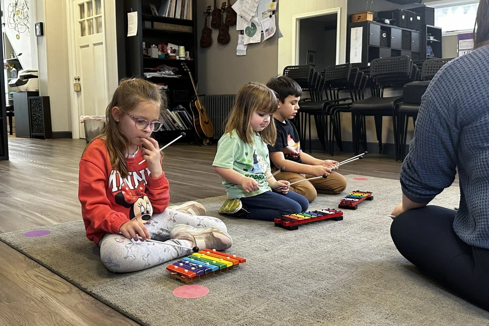 Groove Kids students use bells to listen and learn notes.