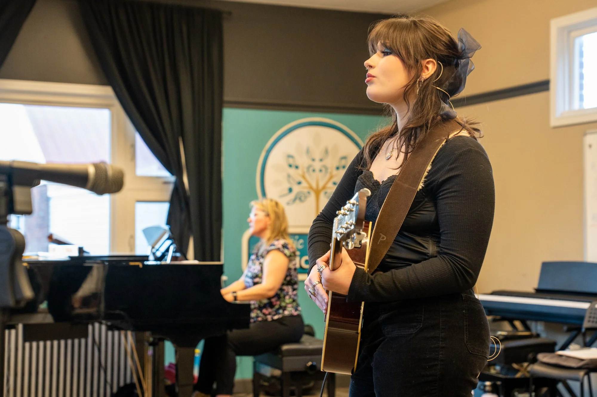 Student playing guitar during rehearsal at the Music Studio of Patricia Keith in Boyertown PA