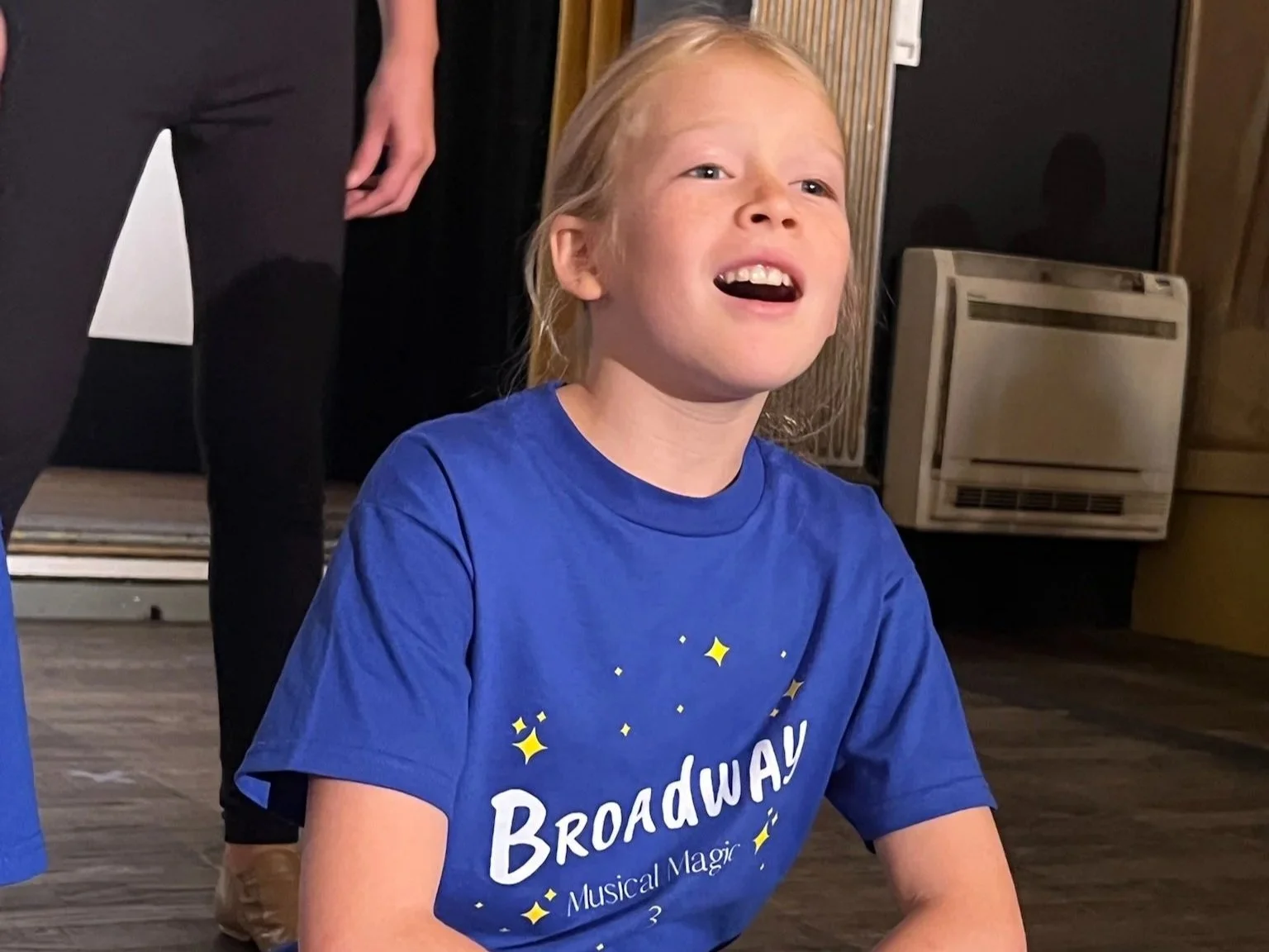 A student sings at a performance
