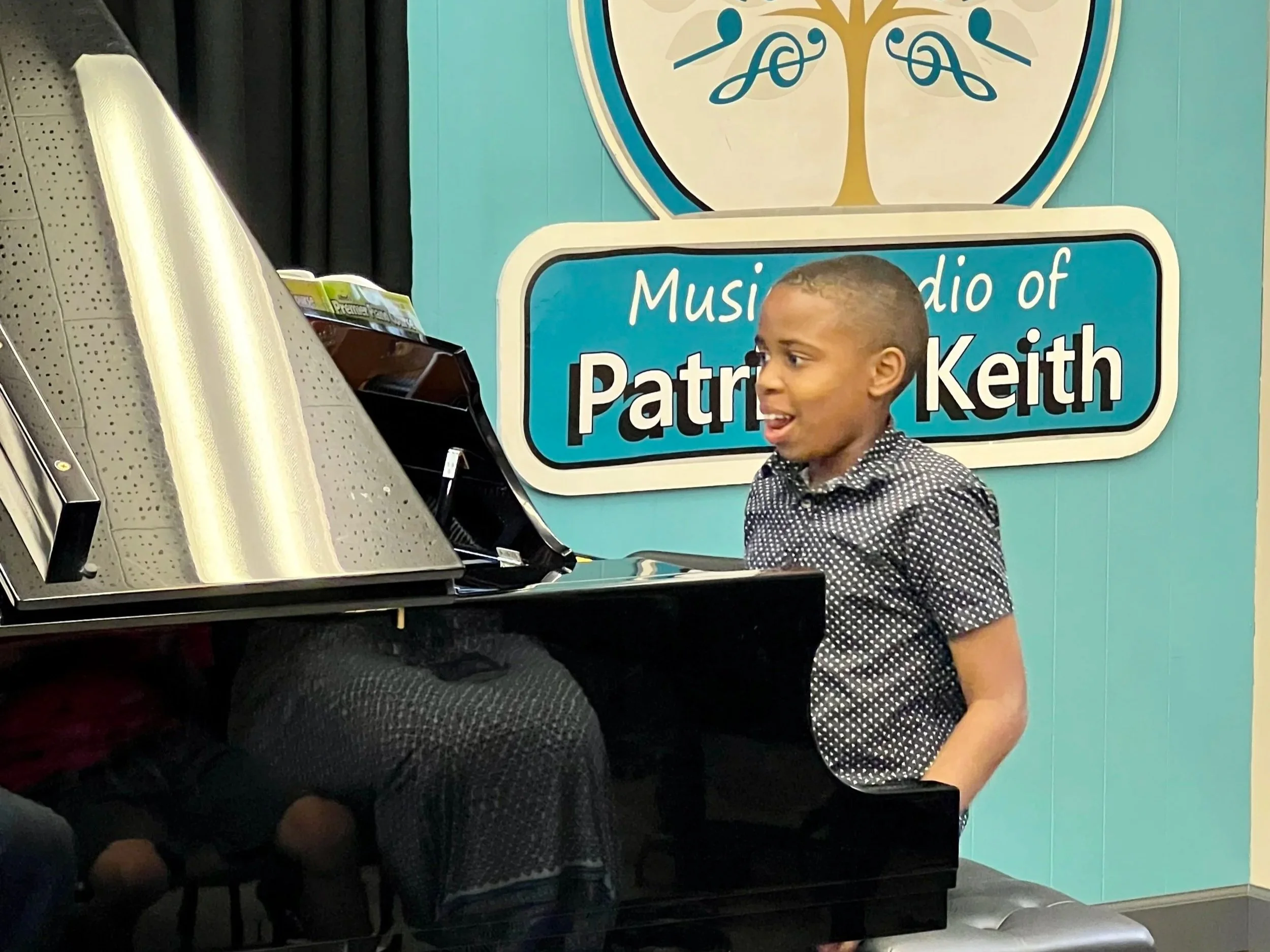 A student performs for his classmates during Deluxe Piano Class at the Music Studio of Patricia Keith in Boyertown PA.