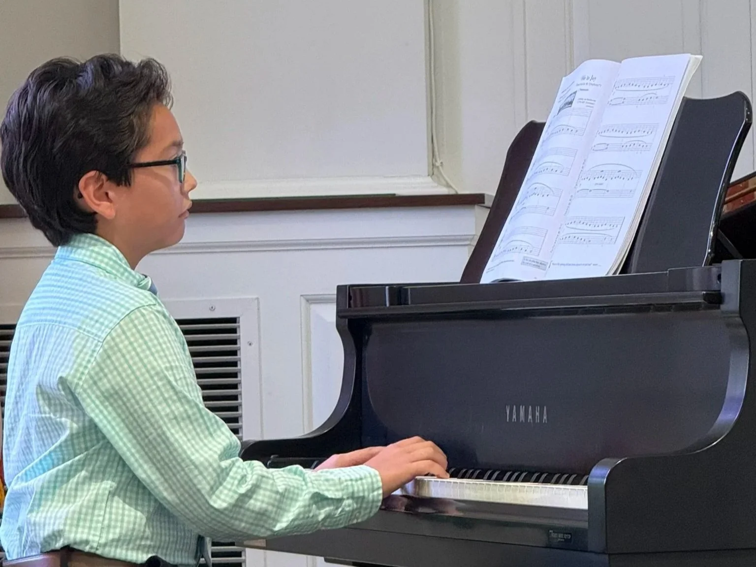 A student dressed formally performs at our spring recital in Boyertown PA.