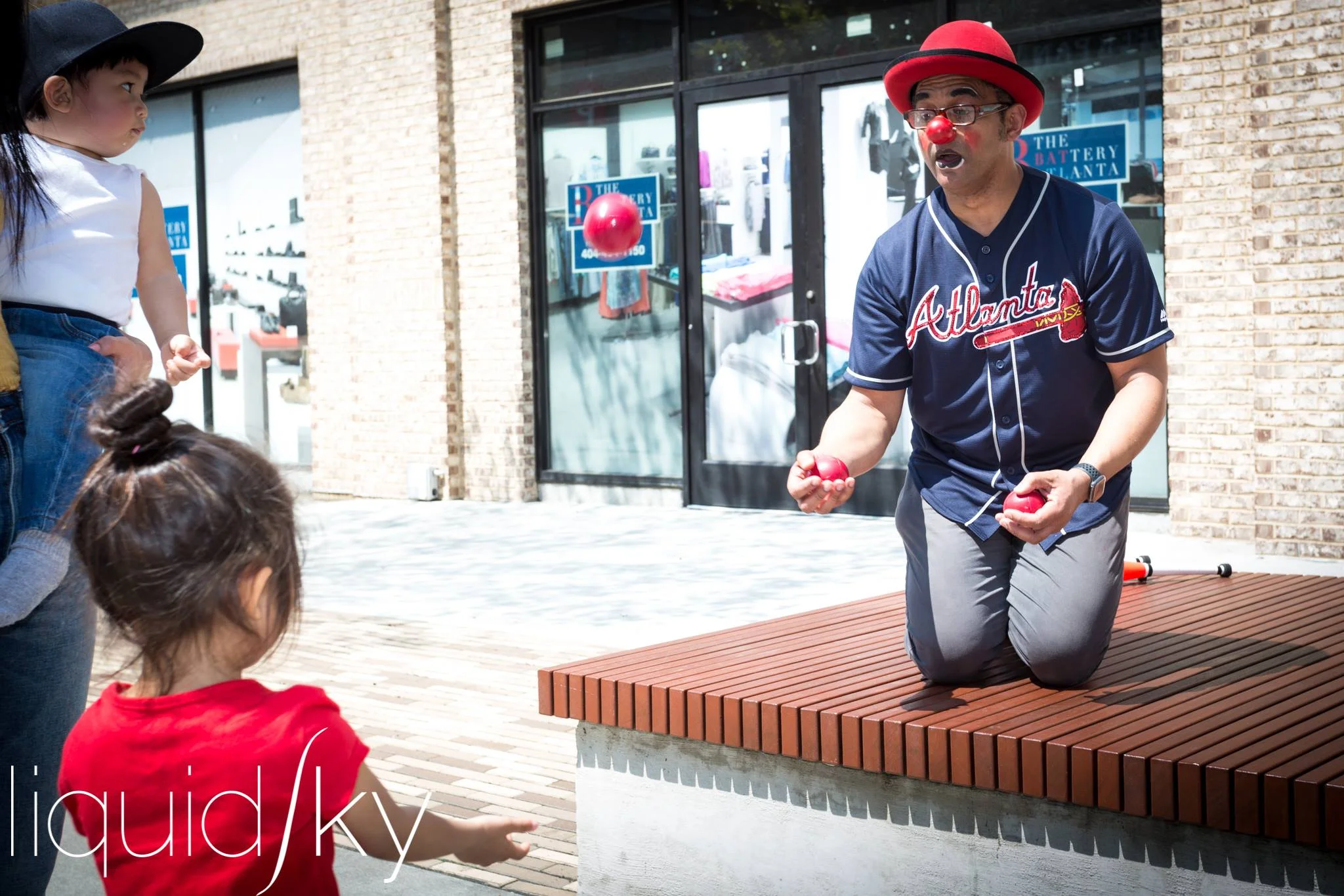 Liquid Sky at Braves toss with child.jpg