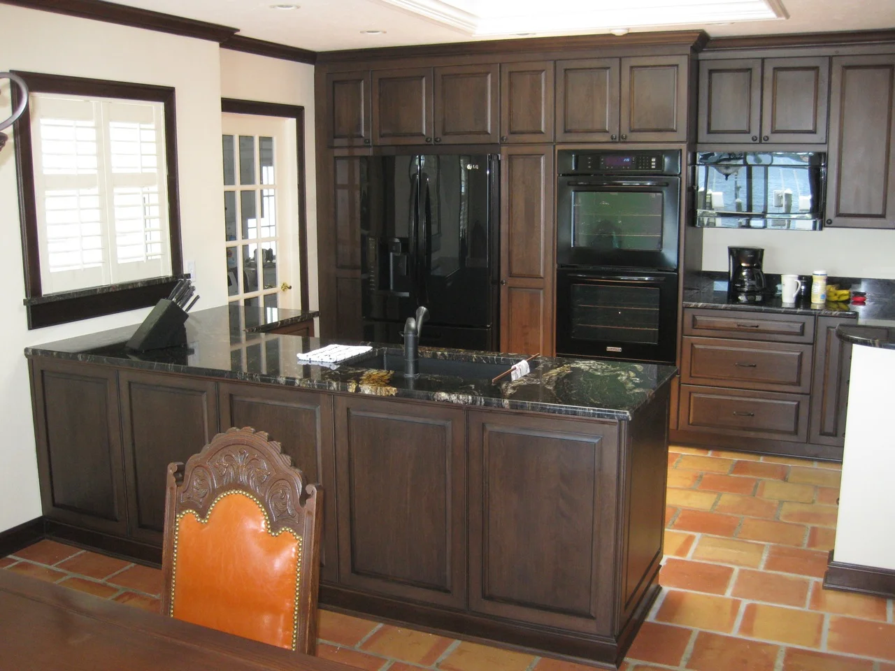 I handled this kitchen remodel project for a private home owner in Sarasota. I designed the new kitchen to create an open feeling that ties into the central spaces of the house. Cabico offers unlimited design options with hundreds of door styles, numerous species of wood, and an almost unlimited palette of finishes, paints and glazes. This project features a 5-step finishing process with a Walnut stain on Red Birch doors with an Heirloom Black glaze. 