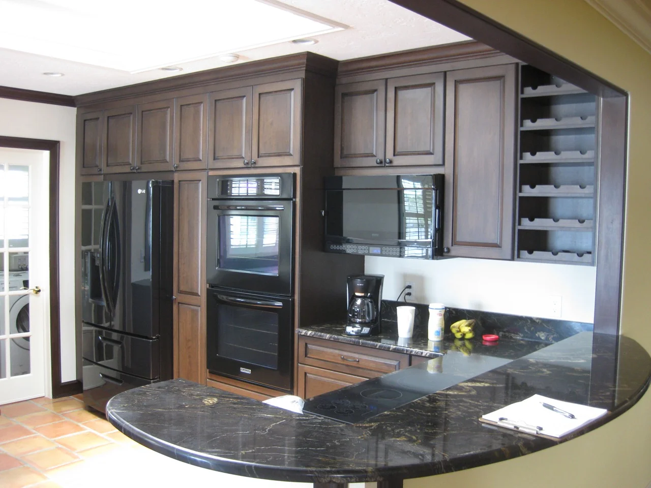 I worked with local craftsmen to create additional trim details which included Red Birch crown moulding and trim finished to match the cabinets and existing trim exactly. This attention to detail provides continuity for the kitchen, blending seamlessly with the existing house.
